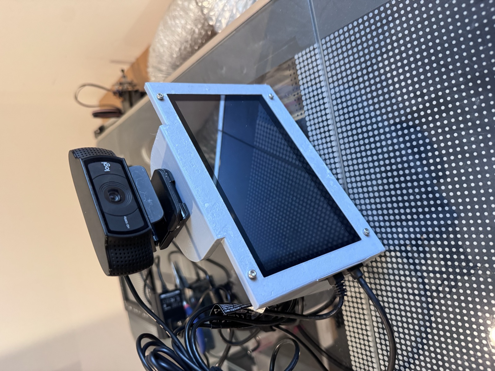 Assembled display and camera shelf